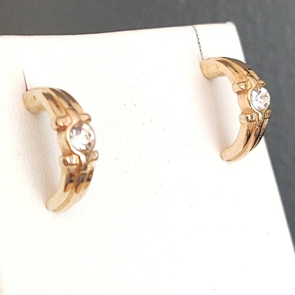 Curved gold tone earrings with faux diamond centers - Picture 3 of 8